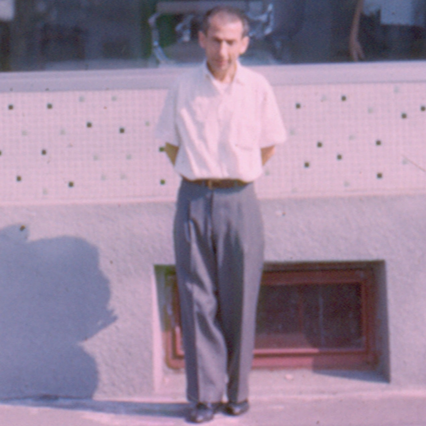 Giacinto in front of his barbershop, 1964